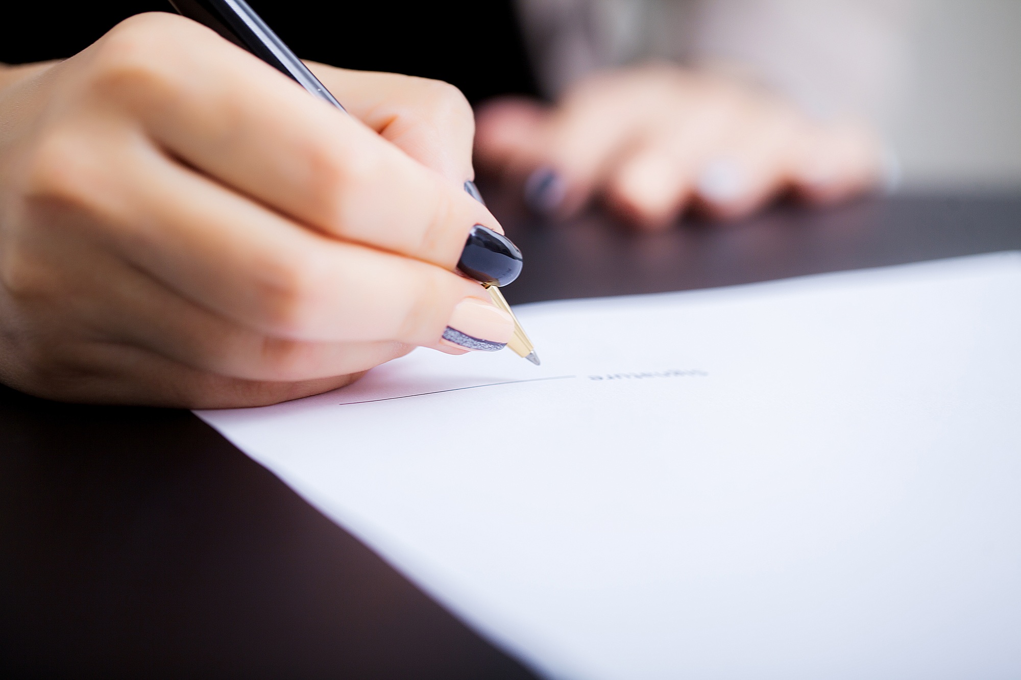 Business woman is signing a contract, business contract details